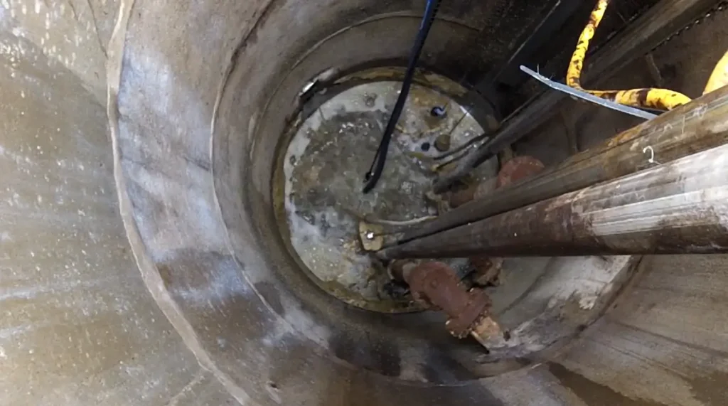 Interior of a municipal lift station wet well where odor-forming compounds develop before ozone wastewater treatment is applied to reduce sulfides, biofilm, and fats, oils, and grease.