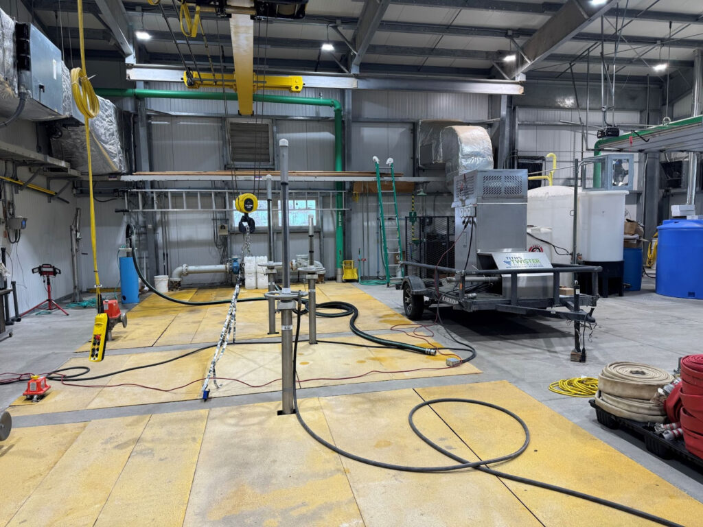 Mobile Titus Twister demo trailer set up at a lift station to show how ozone wastewater treatment resolves odor in real operating conditions.